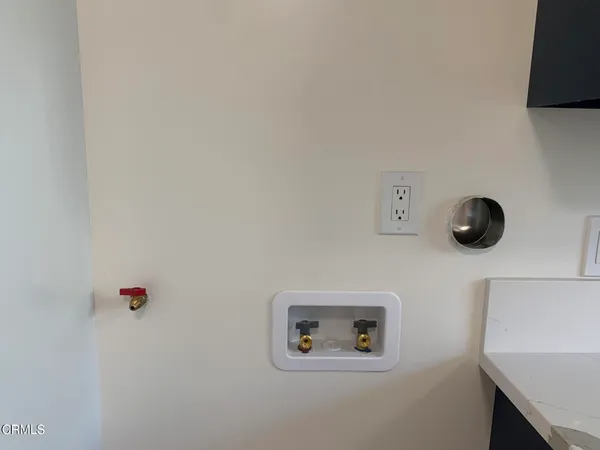 a view of a room with wooden floor and windows