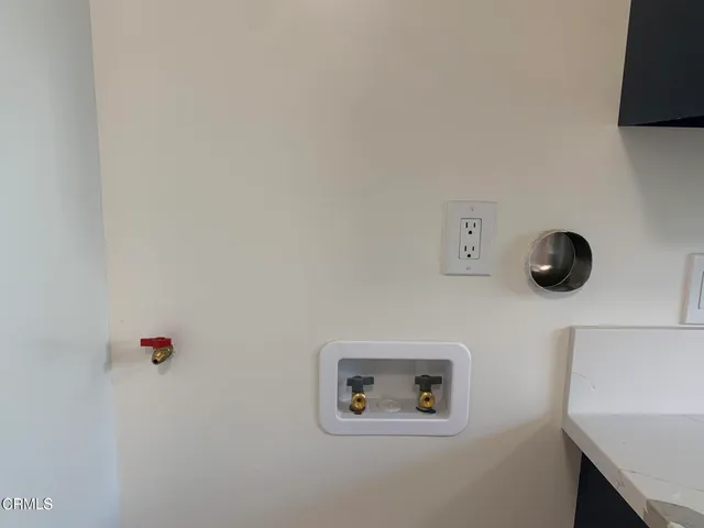 a view of a room with wooden floor and windows