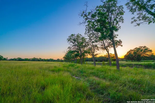 a view of a lake with houses in all around