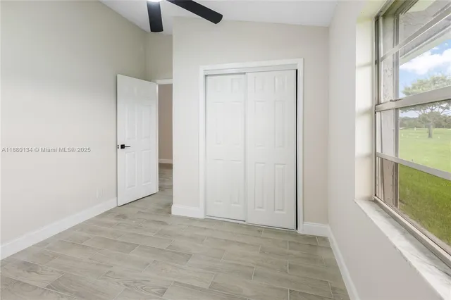 a view of an empty room and window