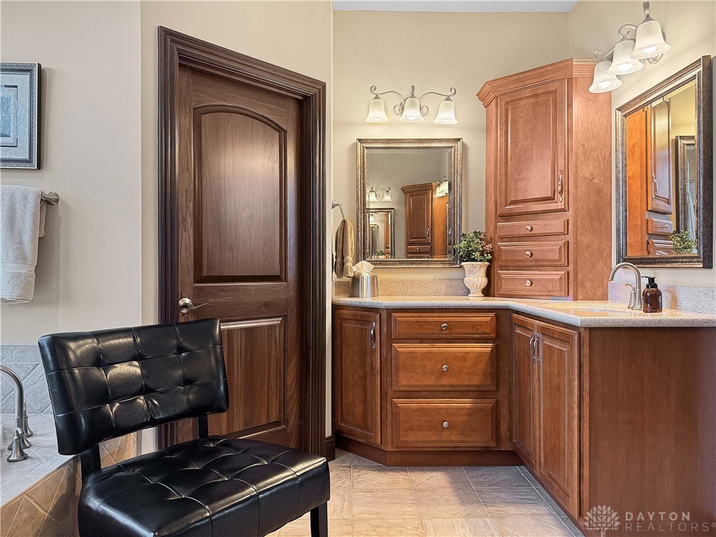 4096 Middle Urbana Road Urbana, OH 43078 - Photo 5 of 96 This bathroom features elegant wood cabinetry and stone countertops.