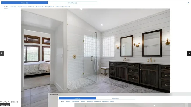 a en suite bathroom with a tub sink and mirror