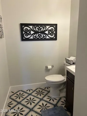 a bathroom with a toilet and a sink