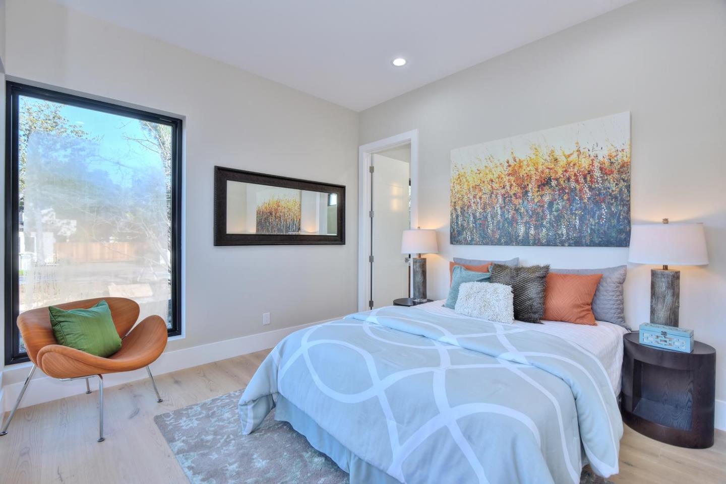 978 Covington Road Los Altos, CA 94024 - Photo 27 of 39 a bedroom with a large bed and a painting on the wall