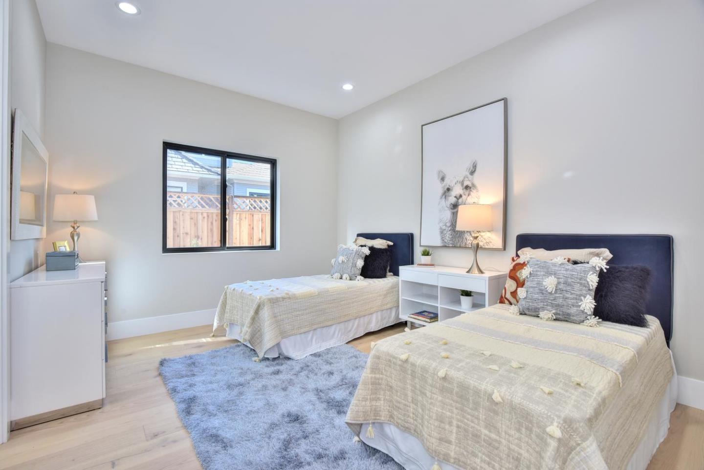 978 Covington Road Los Altos, CA 94024 - Photo 34 of 39 a spacious bedroom with two beds and a table