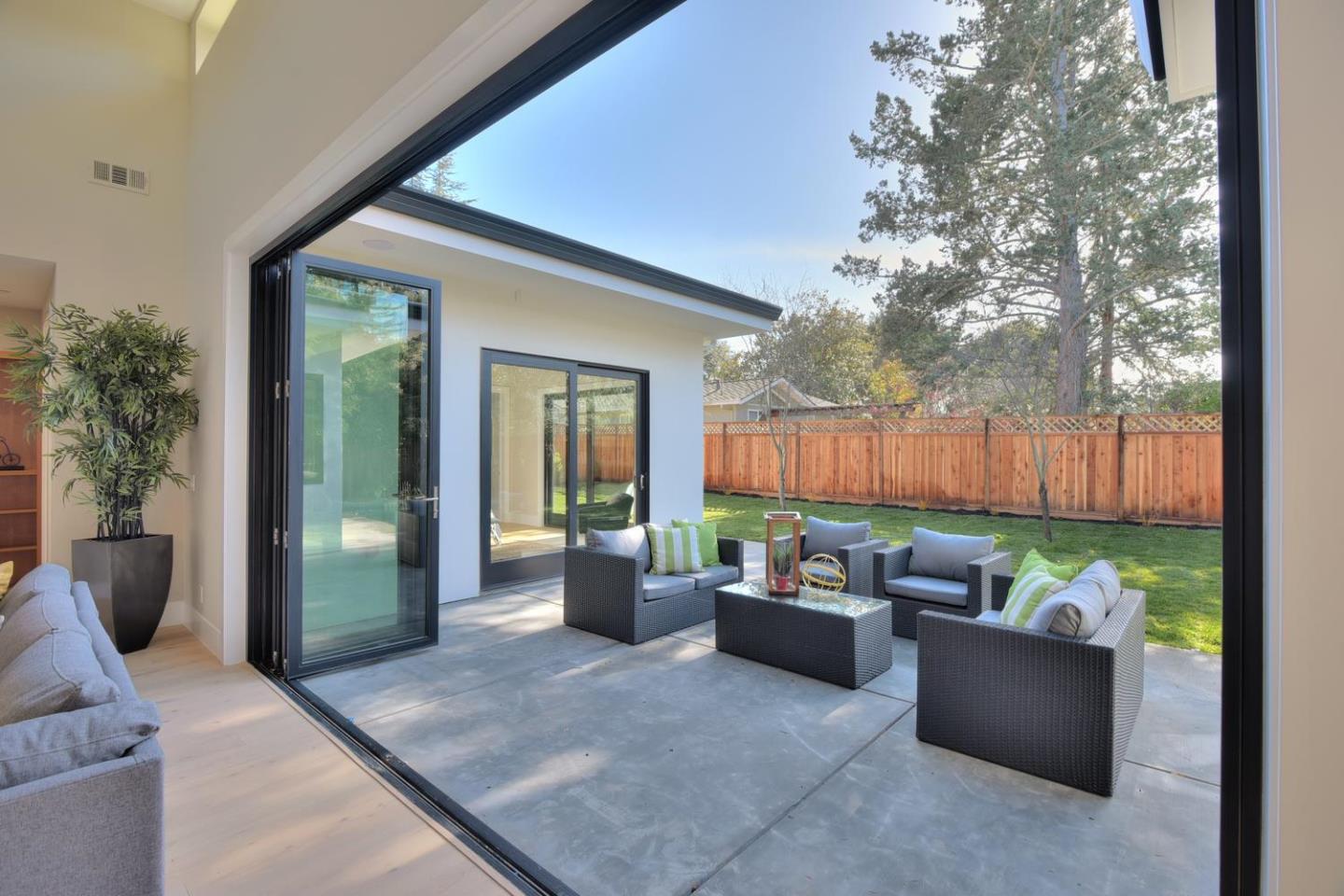 978 Covington Road Los Altos, CA 94024 - Photo 8 of 39 a backyard of a house with barbeque oven table and chairs