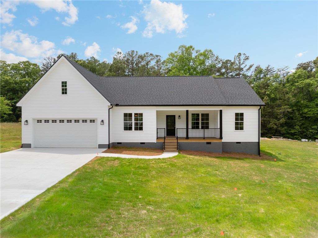 1735 Maw Bridge Road Central, SC 29630 - Photo 1 of 38 A charming single-story residence with a welcoming front porch and attached garage.