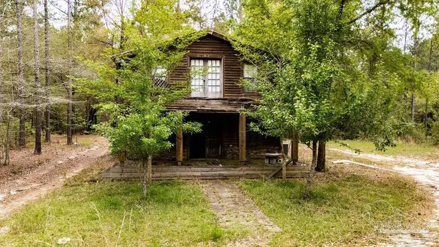 a view of a house with a small yard