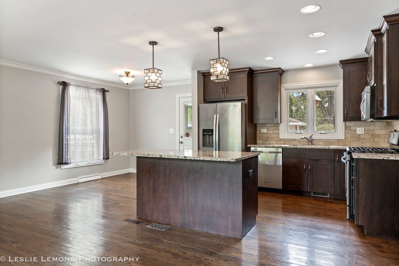132 Robin Hill Drive Naperville, IL 60540 - Photo 15 of 29 a large kitchen with granite countertop a large counter top space and stainless steel appliances