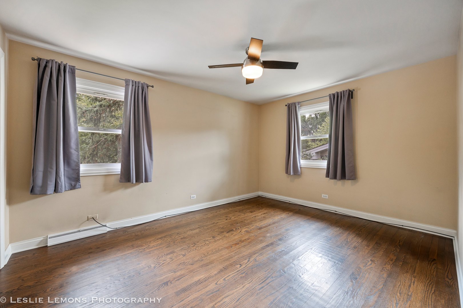 132 Robin Hill Drive Naperville, IL 60540 - Photo 20 of 29 a view of an empty room with wooden floor and a window