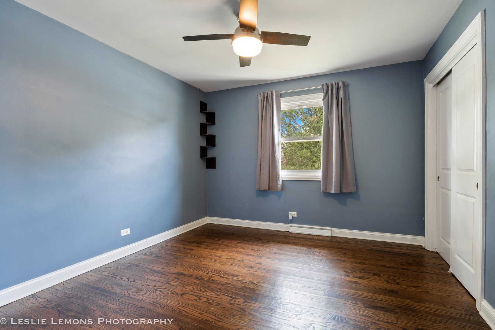 132 Robin Hill Drive Naperville, IL 60540 - Photo 21 of 29 wooden floor in an empty room with a window