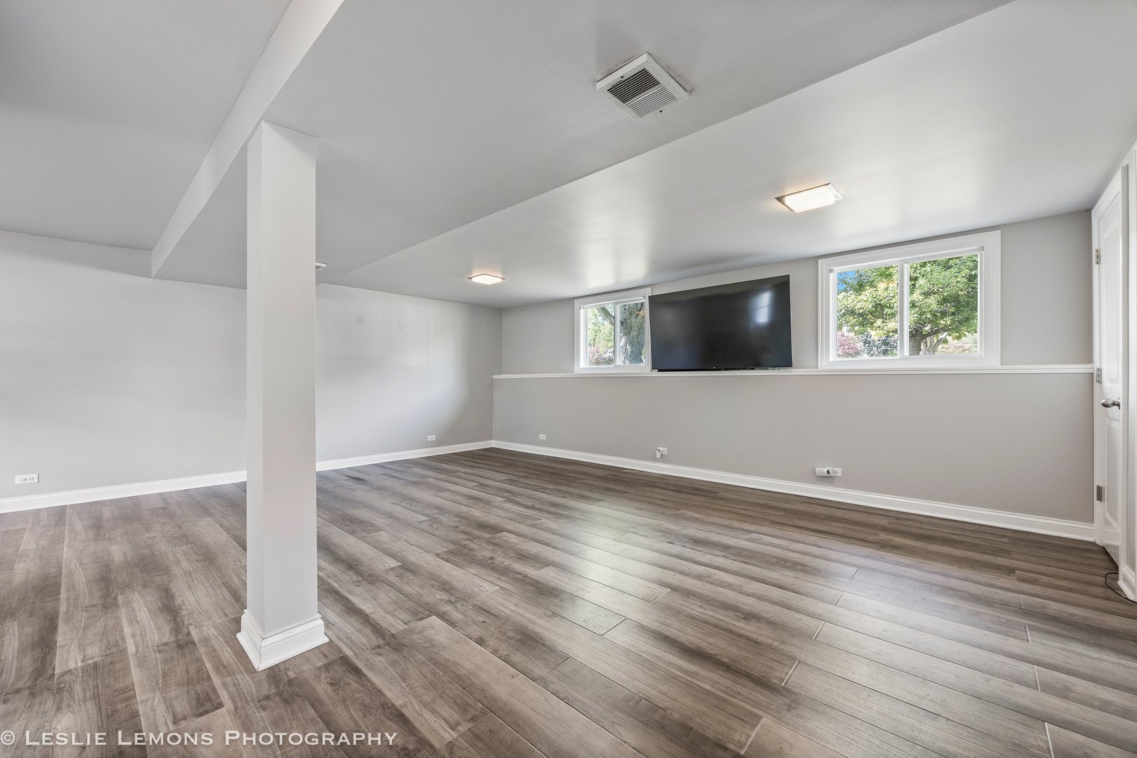 132 Robin Hill Drive Naperville, IL 60540 - Photo 22 of 29 an empty room with wooden floor and windows