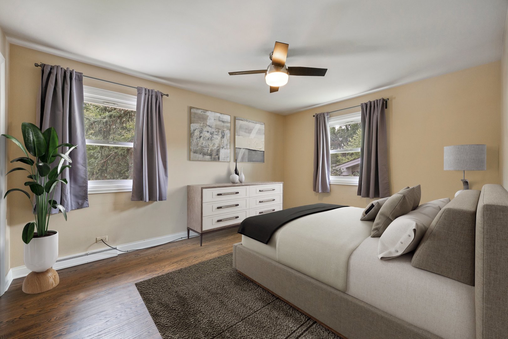 132 Robin Hill Drive Naperville, IL 60540 - Photo 5 of 29 a bedroom with a large bed and wooden floor