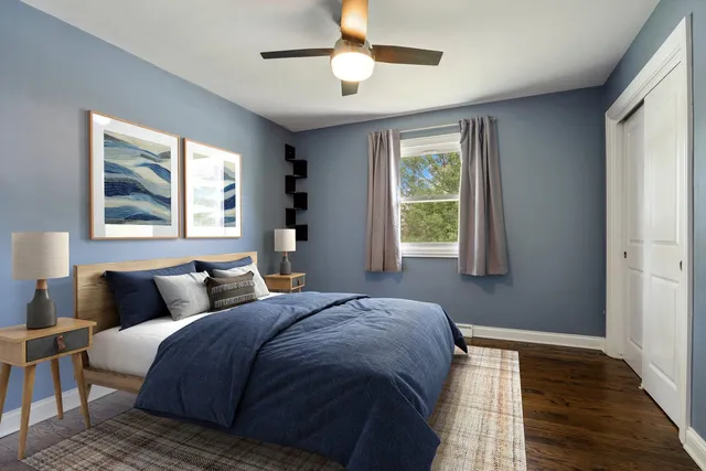 a bedroom with bed and window