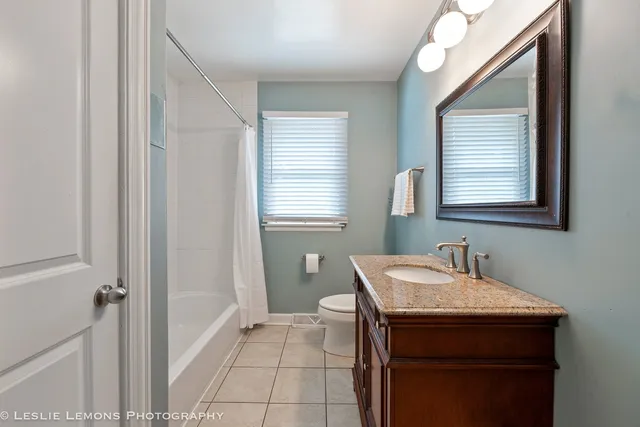 a bathroom with a sink a vanity and a mirror