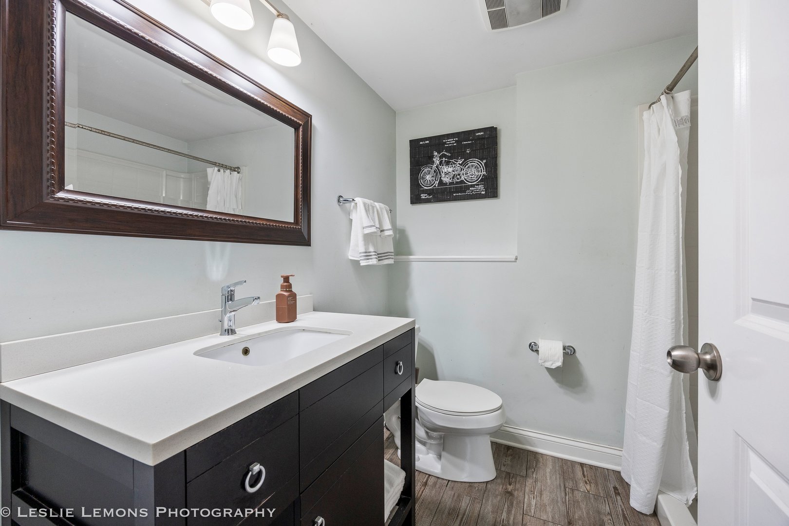 132 Robin Hill Drive Naperville, IL 60540 - Photo 9 of 29 a bathroom with a sink mirror and toilet