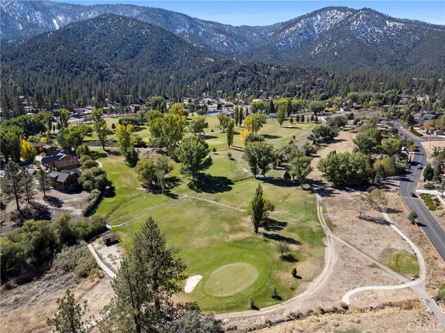 a view of a swimming pool with a yard