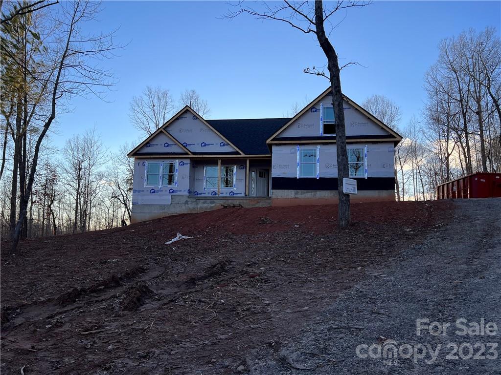 643 Cross Ridge Drive, Unit 120 Rutherfordton, NC 28139 - Photo 2 of 4 a front view of a house with a yard