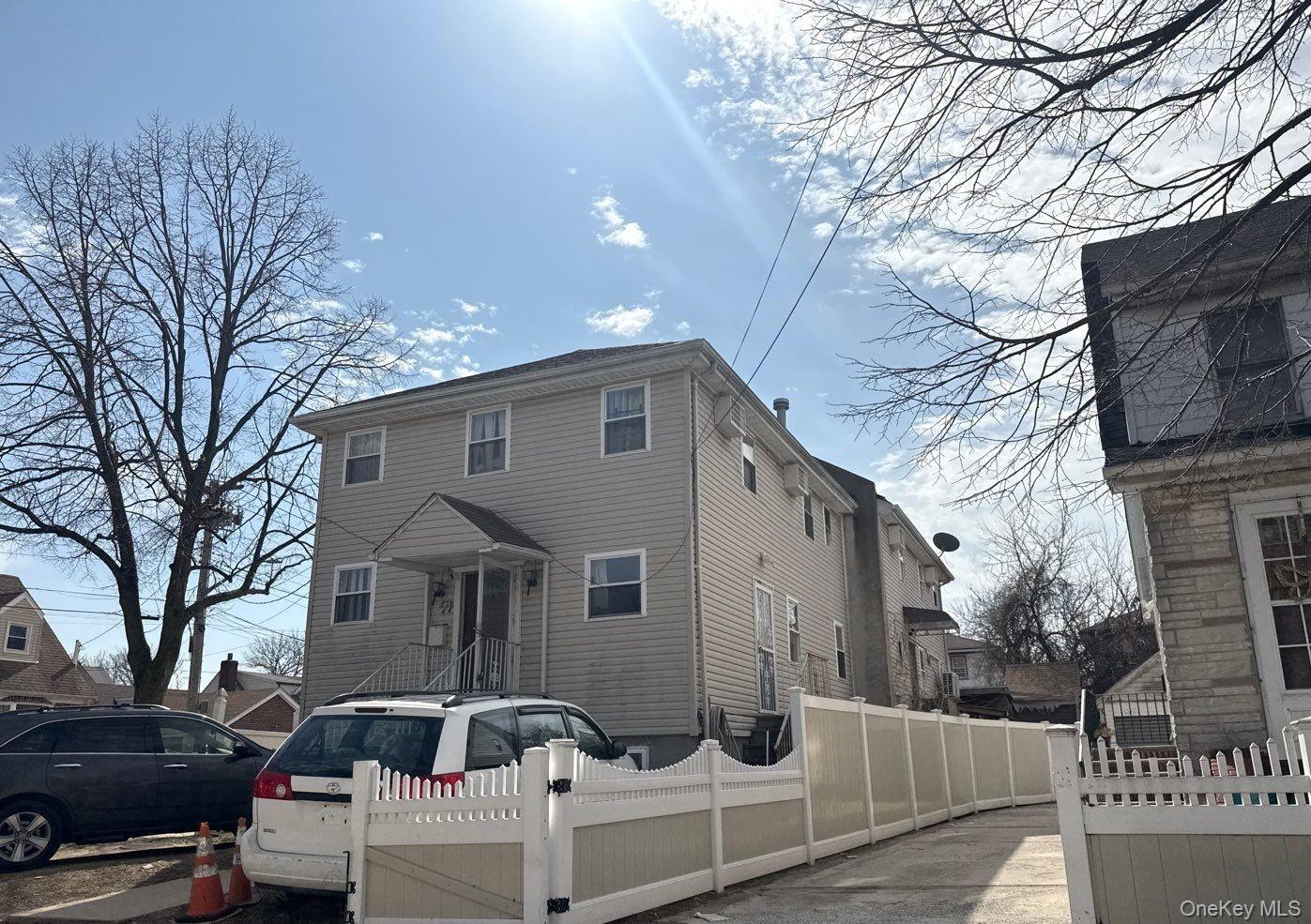 179-44 143rd Road Queens, NY 11434 - Photo 2 of 4 a front view of a house with parking space