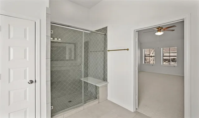 a bathroom with a shower and a sink