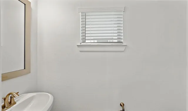 a bathroom with a sink and a vanity