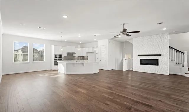a view of a kitchen with a sink and a stove top oven