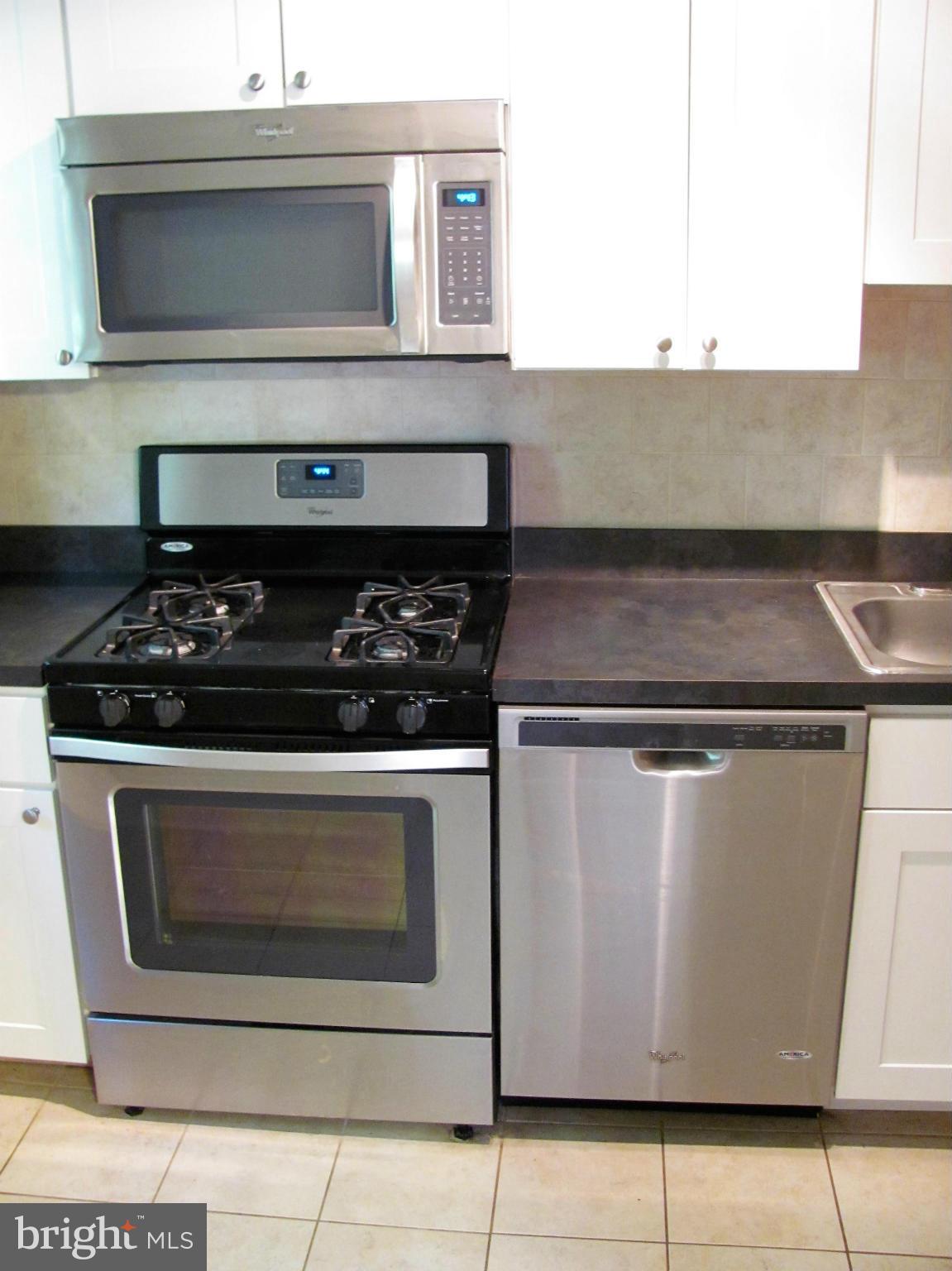 8528 Water Oak Road Baltimore, MD 21234 - Photo 17 of 30 a stove top oven sitting inside of a kitchen
