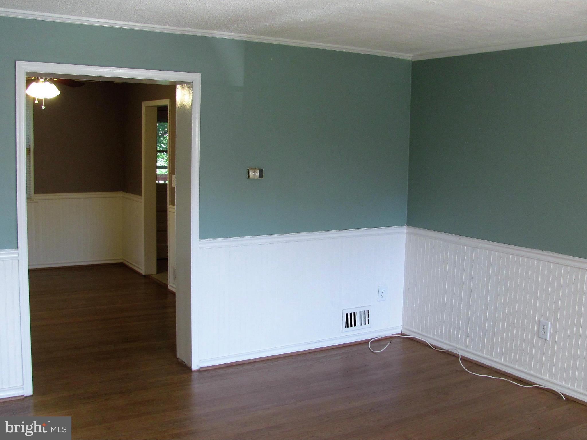 8528 Water Oak Road Baltimore, MD 21234 - Photo 4 of 30 an empty room with wooden floor and closet