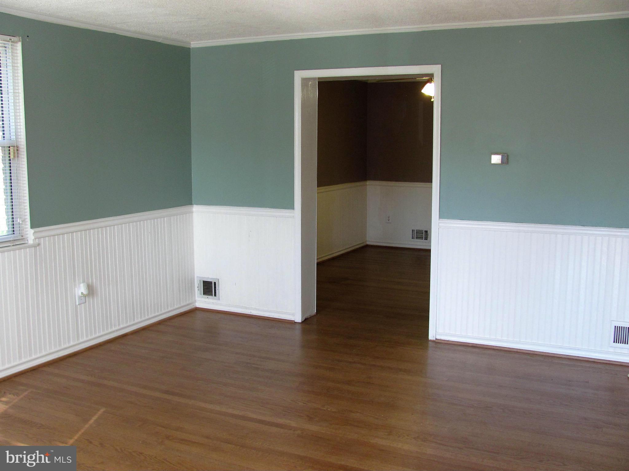 8528 Water Oak Road Baltimore, MD 21234 - Photo 5 of 30 a view of an empty room with wooden floor