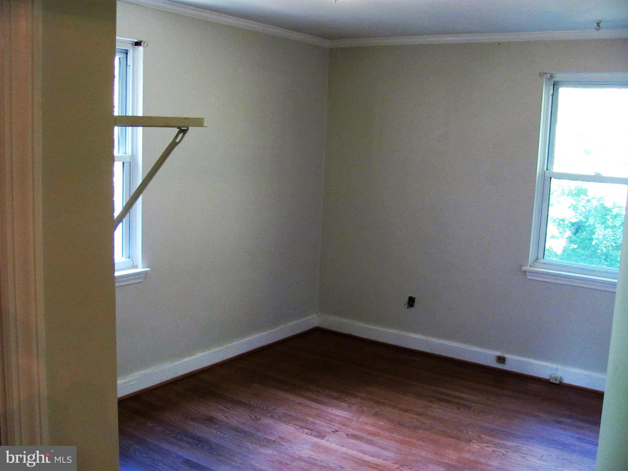 8528 Water Oak Road Baltimore, MD 21234 - Photo 10 of 30 a view of an empty room with wooden floor and a window