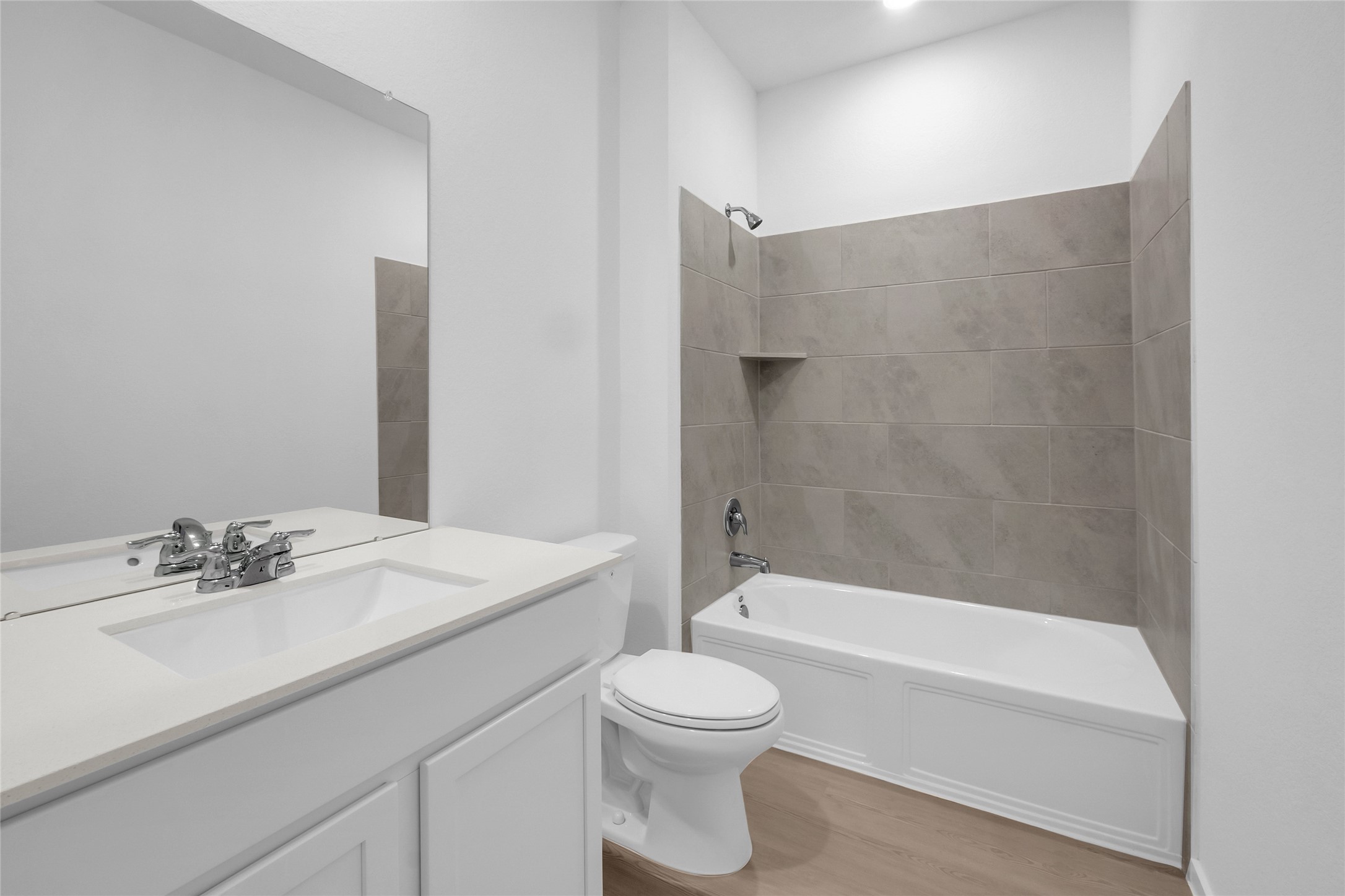 7923 Evening Emerald Drive Rosharon, TX 77583 - Photo 12 of 28 a bathroom with a sink a toilet and a bathtub