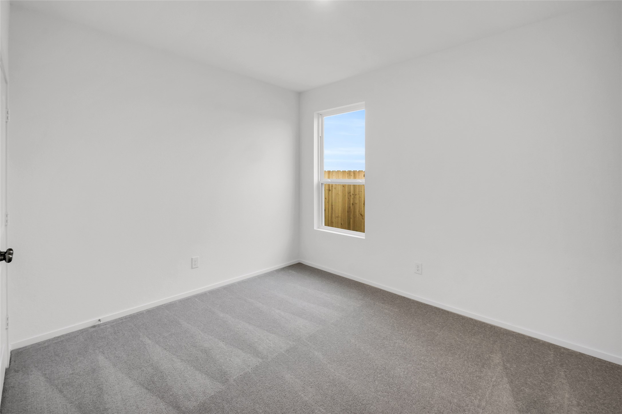7923 Evening Emerald Drive Rosharon, TX 77583 - Photo 13 of 28 a view of an empty room and a window