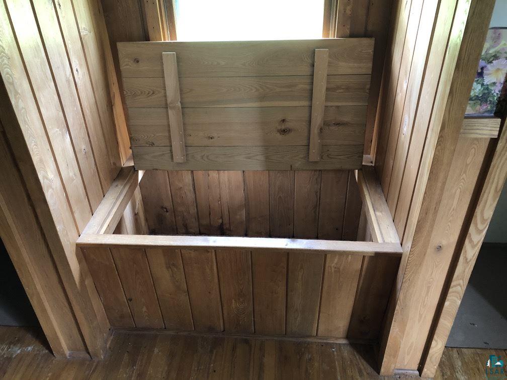 75198 Eichmann Road Glidden, WI 54527 - Photo 20 of 44 Bench seat and built in storage in master bedroom