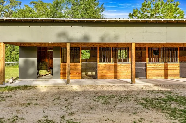 a view of a brick house with an outdoor space