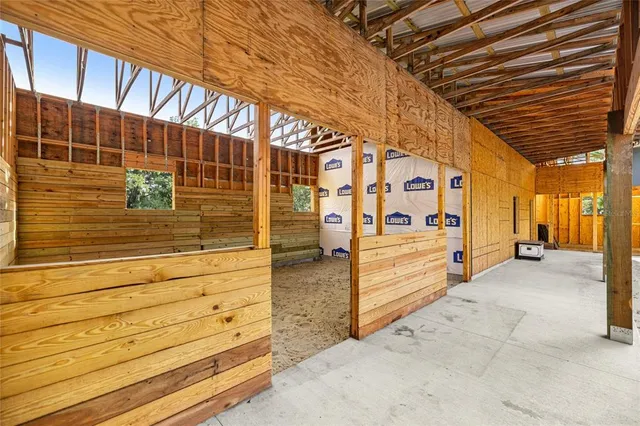 a view of a room with wooden walls