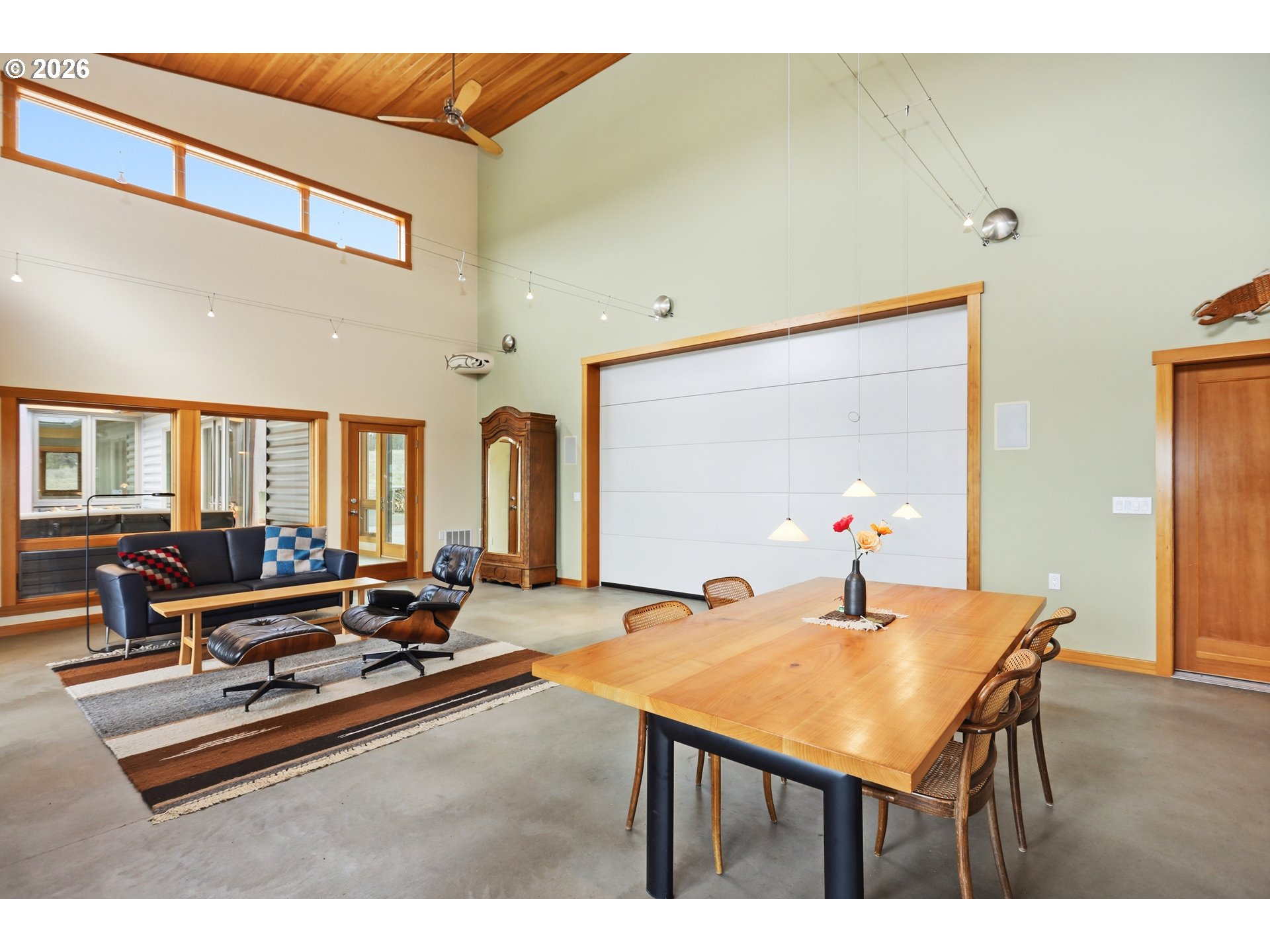 505 Knight Road Goldendale, WA 98620 - Photo 11 of 48 a living room with furniture a flat screen tv and a large window