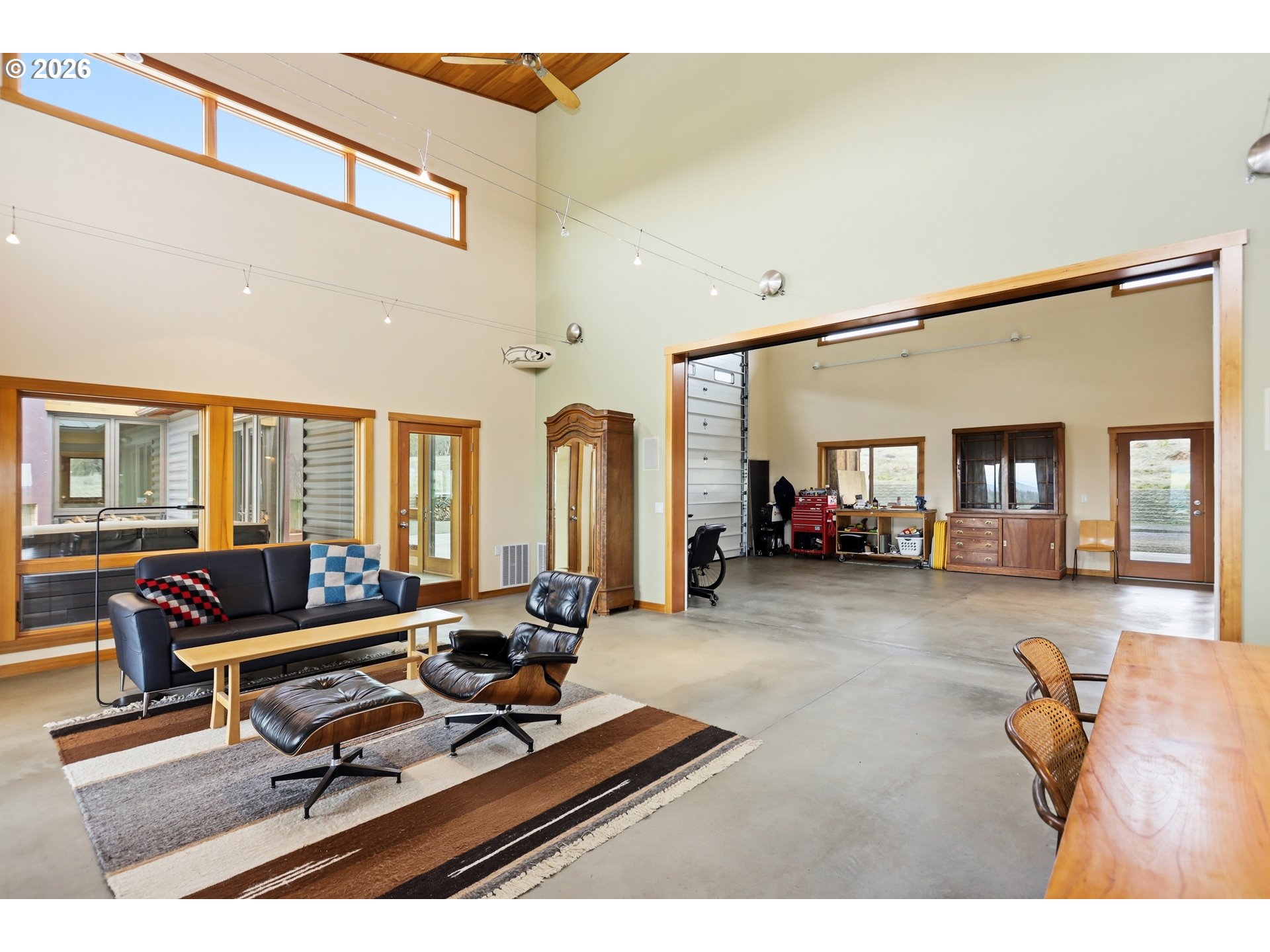 505 Knight Road Goldendale, WA 98620 - Photo 12 of 48 a living room with furniture gym equipment and large windows