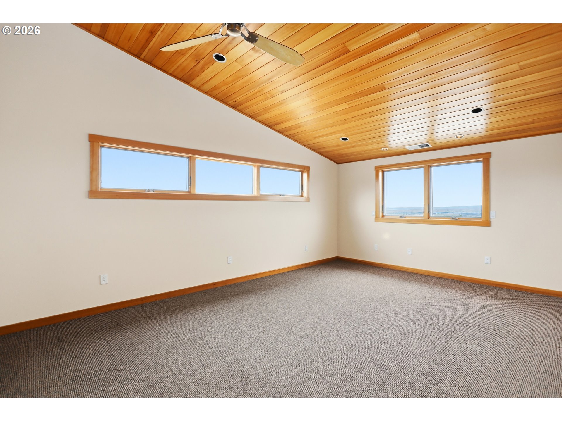 505 Knight Road Goldendale, WA 98620 - Photo 16 of 48 a view of an empty room with wooden floor and a window