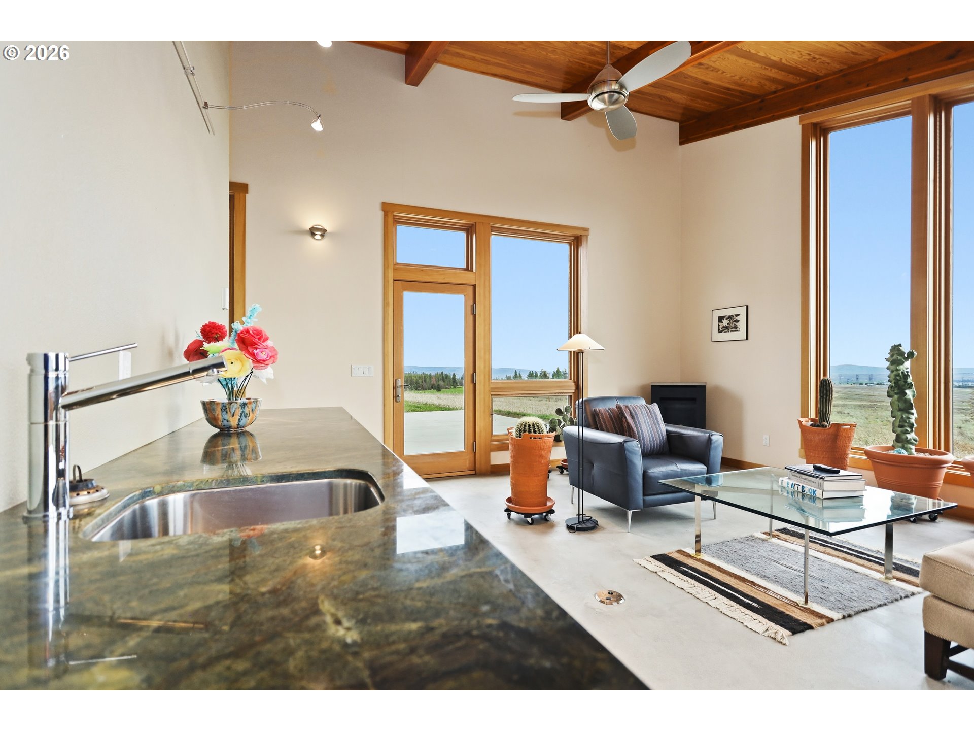 505 Knight Road Goldendale, WA 98620 - Photo 23 of 48 a living room with furniture and floor to ceiling windows