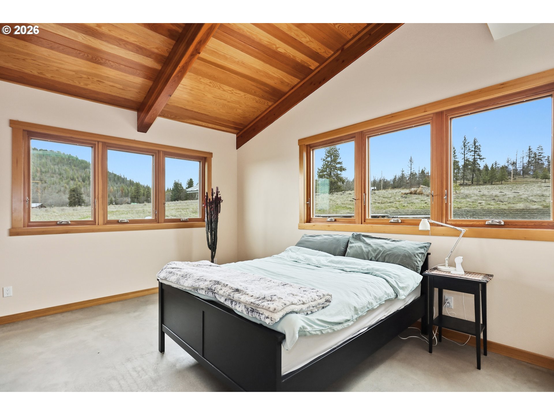 505 Knight Road Goldendale, WA 98620 - Photo 24 of 48 a bedroom with a bed and a large window with outer view