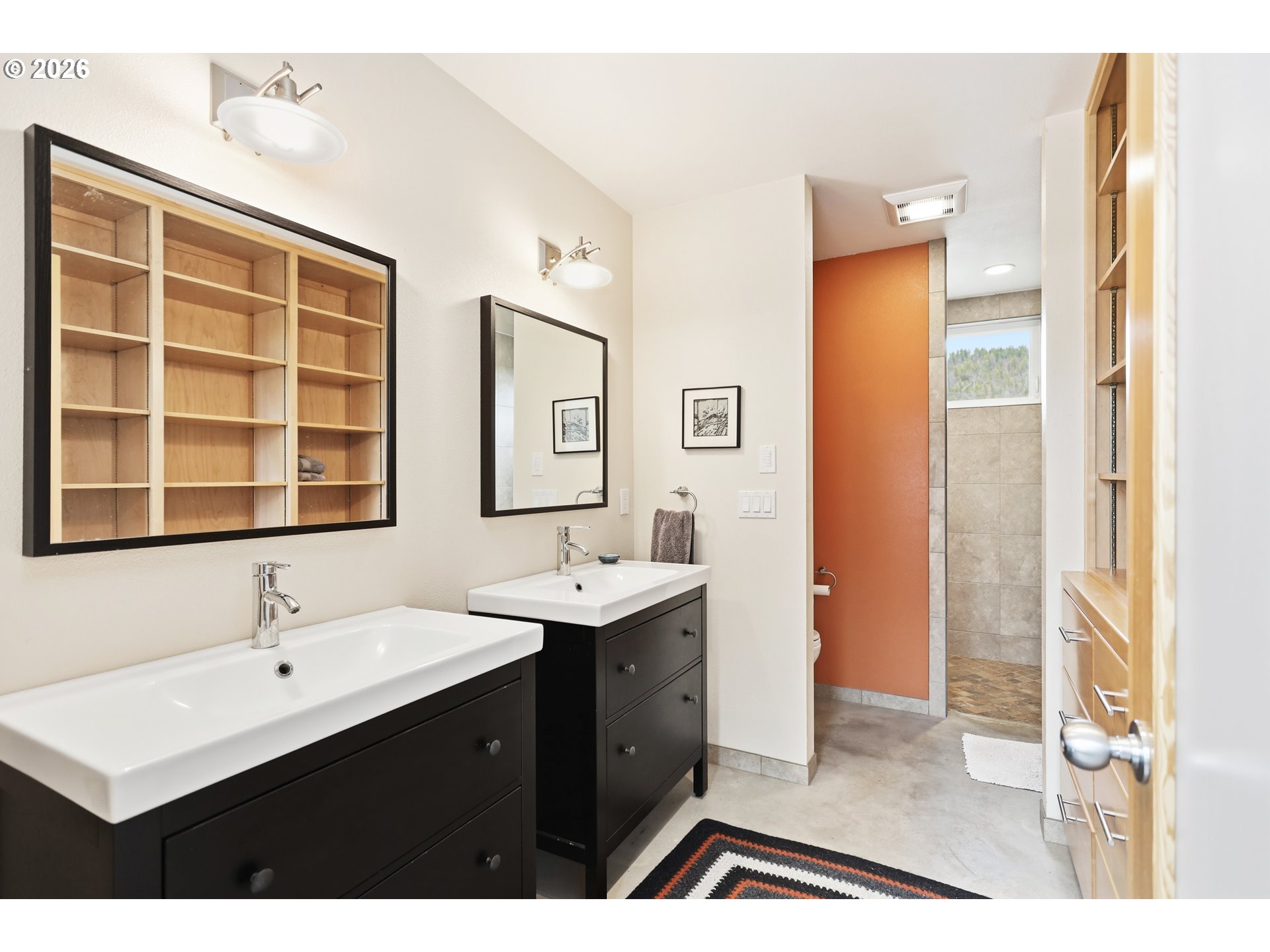 505 Knight Road Goldendale, WA 98620 - Photo 25 of 48 a bathroom with a double vanity sink a mirror and a shower