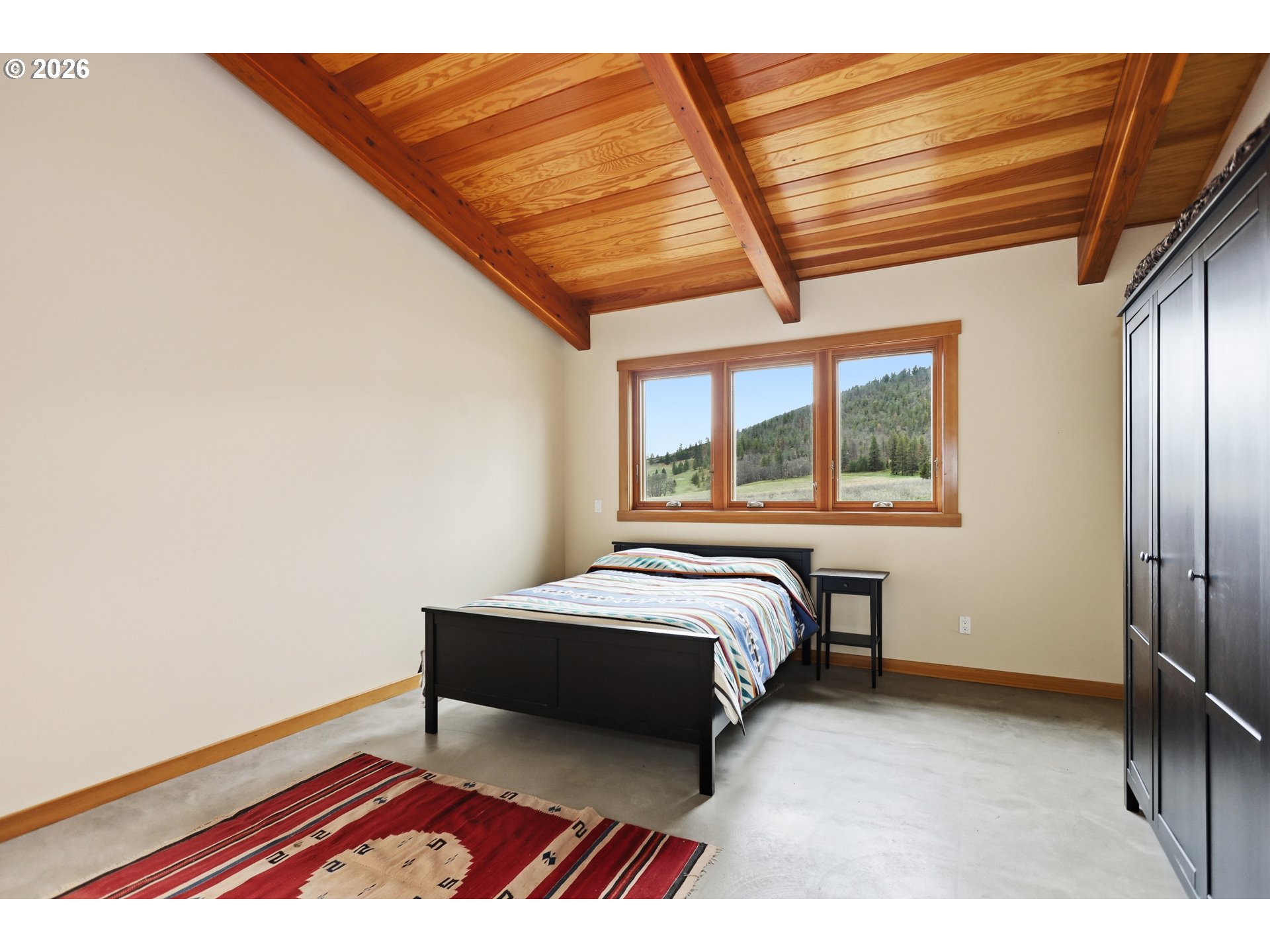 505 Knight Road Goldendale, WA 98620 - Photo 27 of 48 a bedroom with a bed and a window