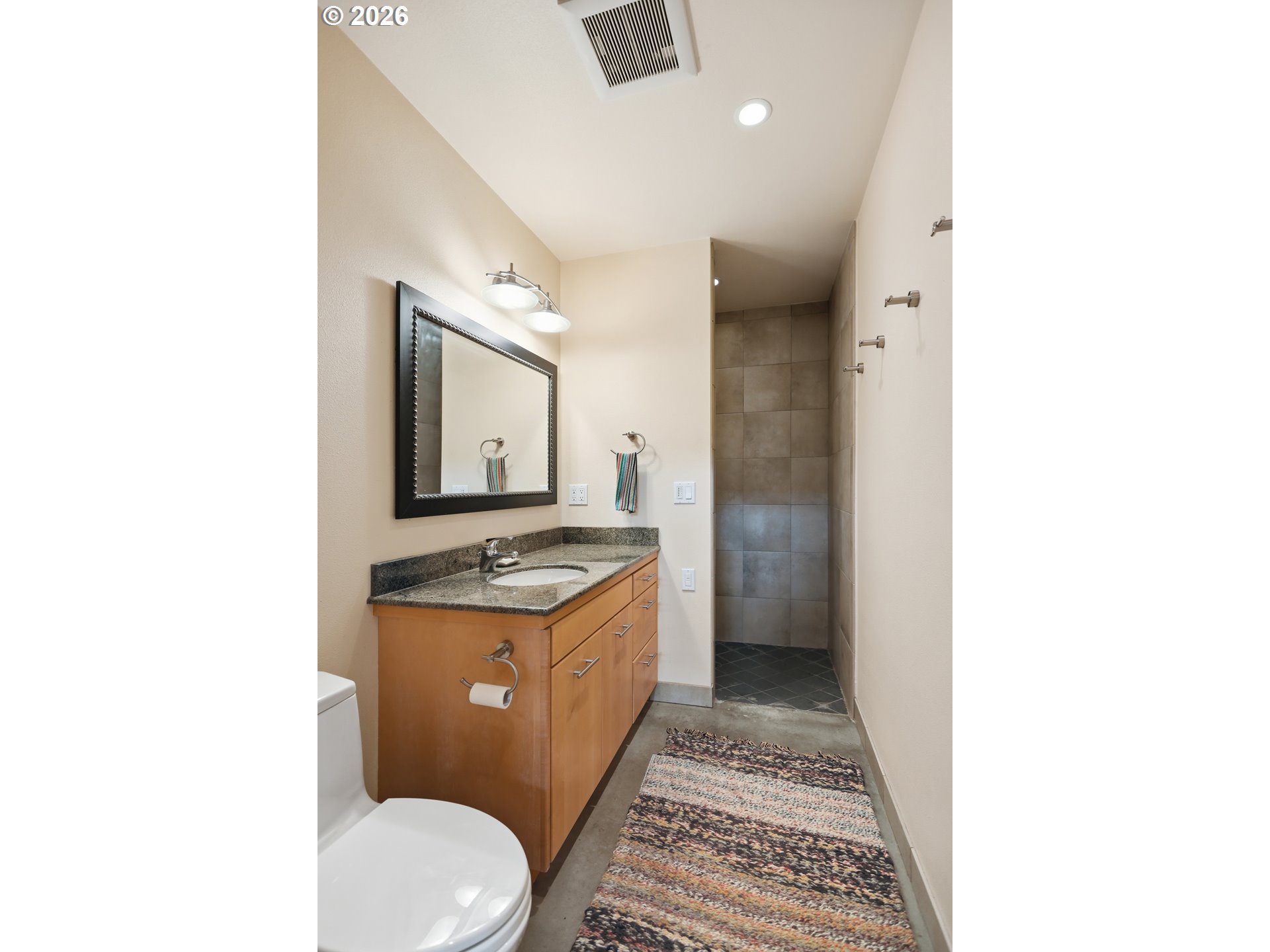 505 Knight Road Goldendale, WA 98620 - Photo 7 of 48 a bathroom with a granite countertop toilet sink and mirror