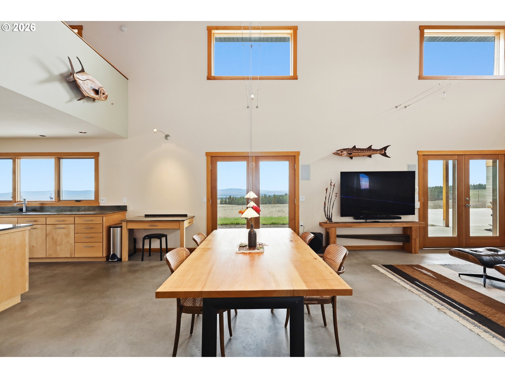 505 Knight Road Goldendale, WA 98620 - Photo 8 of 48 a living room with dining table and a flat screen tv