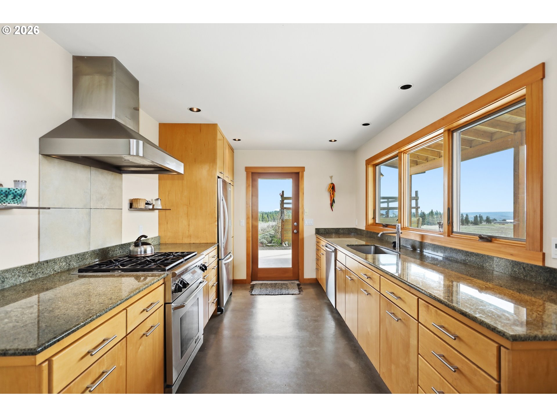 505 Knight Road Goldendale, WA 98620 - Photo 9 of 48 a kitchen with a sink a stove and cabinets