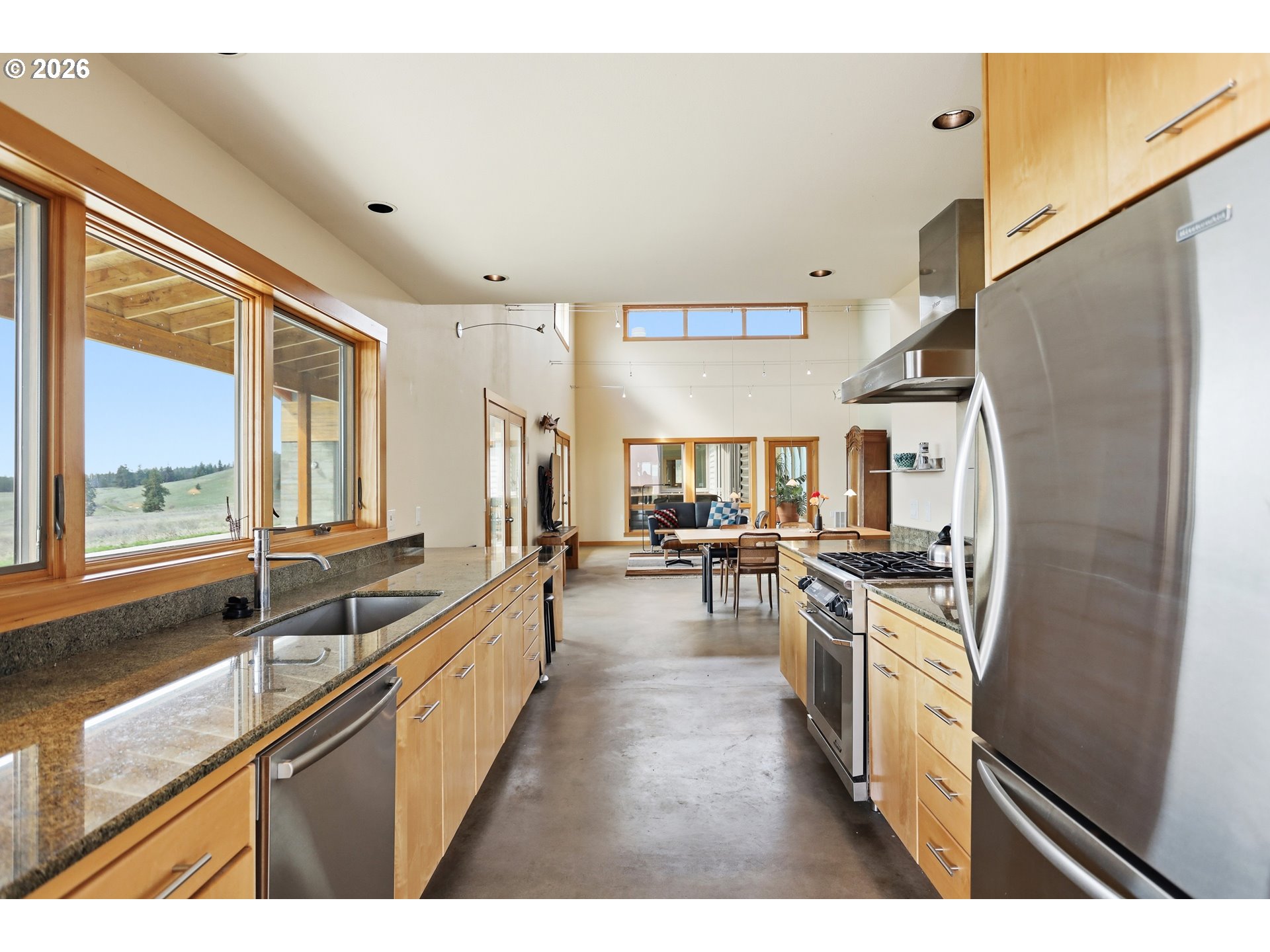 505 Knight Road Goldendale, WA 98620 - Photo 10 of 48 a kitchen with stainless steel appliances granite countertop a sink stove and refrigerator