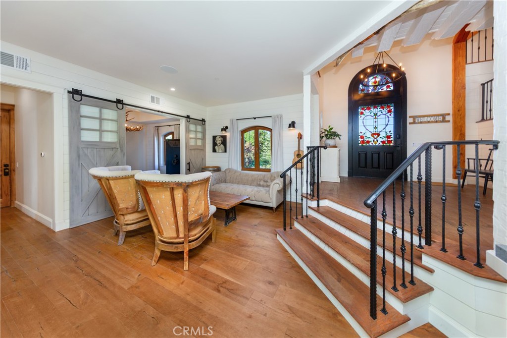 85 Saddlebow Road Bell Canyon, CA 91307 - Photo 18 of 75 a living room with furniture a dining table and wooden floor