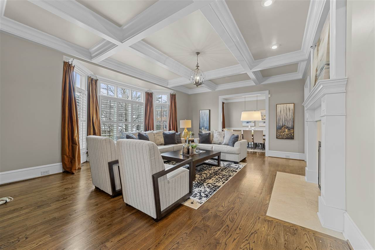 503 Guilford Circle Raleigh, NC 27608 - Photo 5 of 28 Flooded with light from the front yard, the living room is an oasis of relaxation beneath a gorgeous coffered ceiling. Living Room