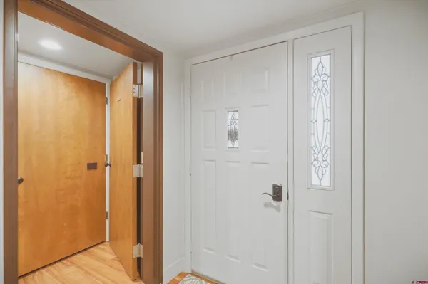 a view of a hallway with closet area