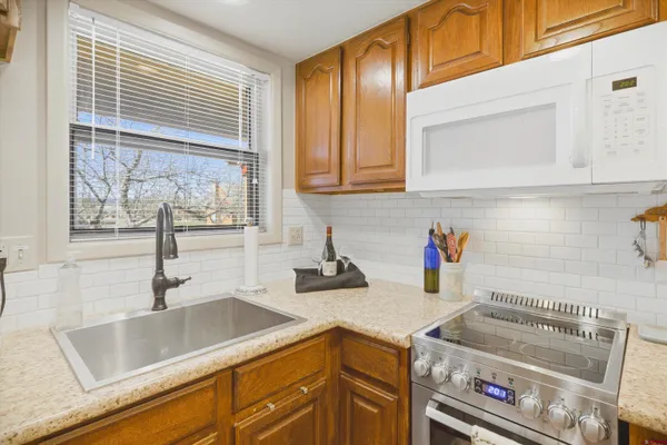 a kitchen with a sink and a stove